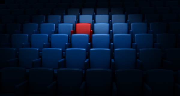 Disconnection leads to empty audiences One red seat in a sea of blue in an empty auditorium